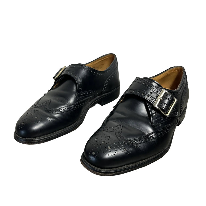 Paire de monks Ted Lapidus vintage en cuir noir à bout golf, vue trois-quarts